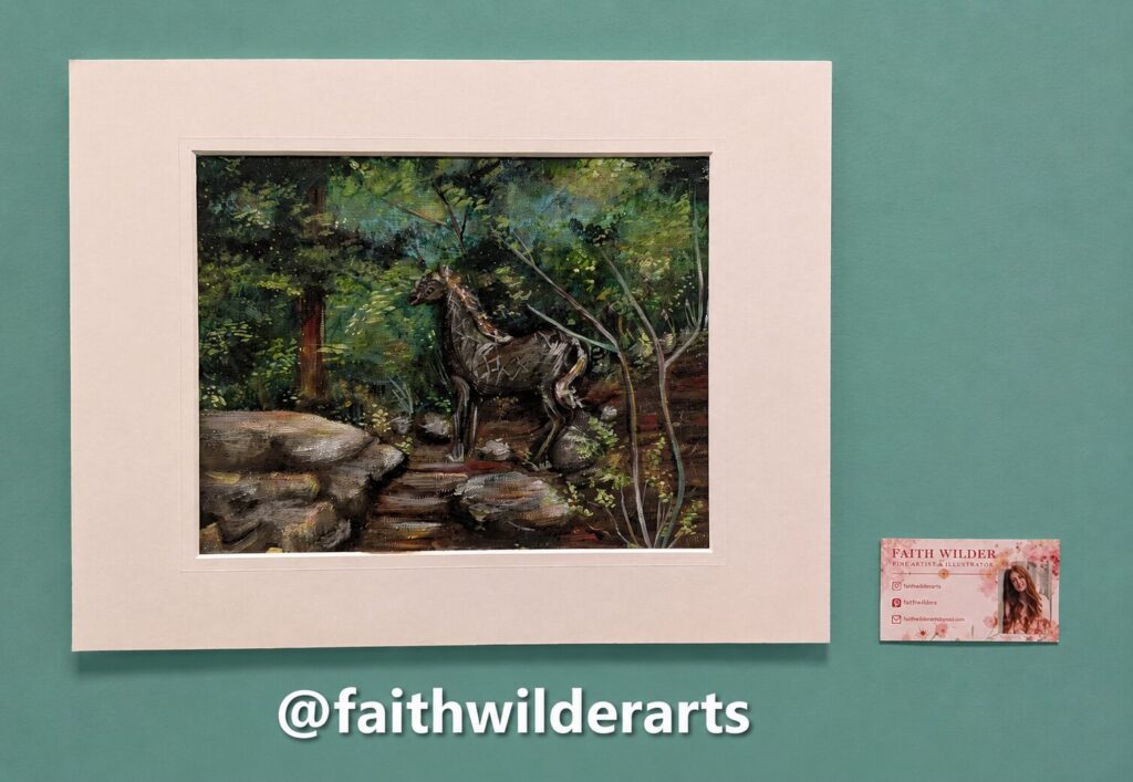 A matted painting by Faith Wilder of a horse on a rocky forest path, with the artist's business card beside it